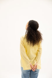 Ruffle Me Up Blouse In Butter Yellow