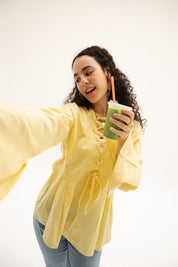 Ruffle Me Up Blouse In Butter Yellow